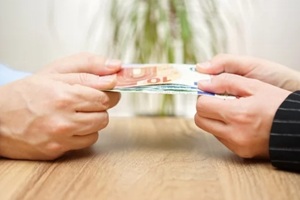 man and woman are fighting over money