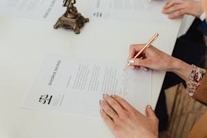Person Signing Divorce Paper