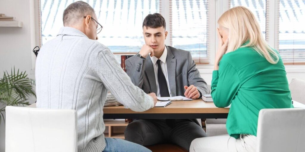 annulment divorce lawyer with mature couple signing document in office in Maryland