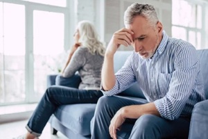 upset senior couple at home