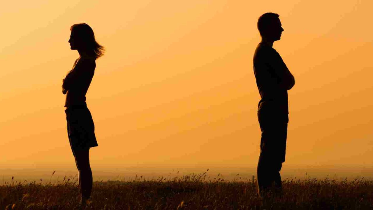 Couple fighting over Retirement Funds standing outside