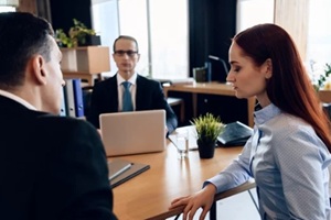 adult couple gets divorced from attorney for divorce in lawyer office