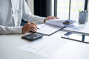 Financial analyst reviewing high asset divorce agreement