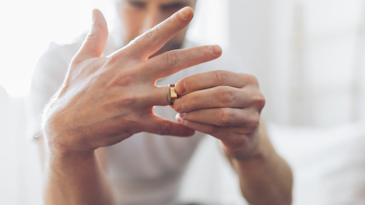 Howard county, MD man taking off wedding ring after filing for divorce