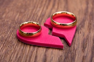 golden ring on red broken heart