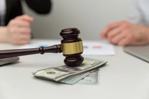 closeup view of wooden gavel and money