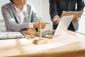 lawyers are in an office, discussing legal documents and case details